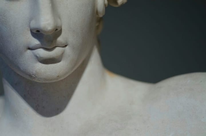 Head and shoulders of a Greek statue