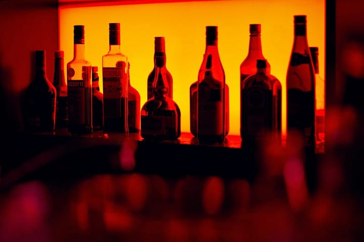 Bottles in a dim orange light